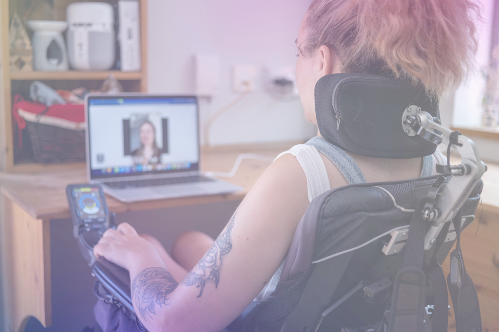 Cool tattooed woman in a wheelchair using web services with ease thanks to good accessible design and implementation of standards.