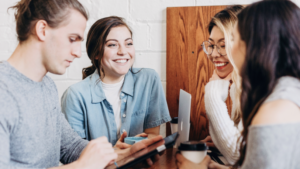 people sitting, talking and smiling