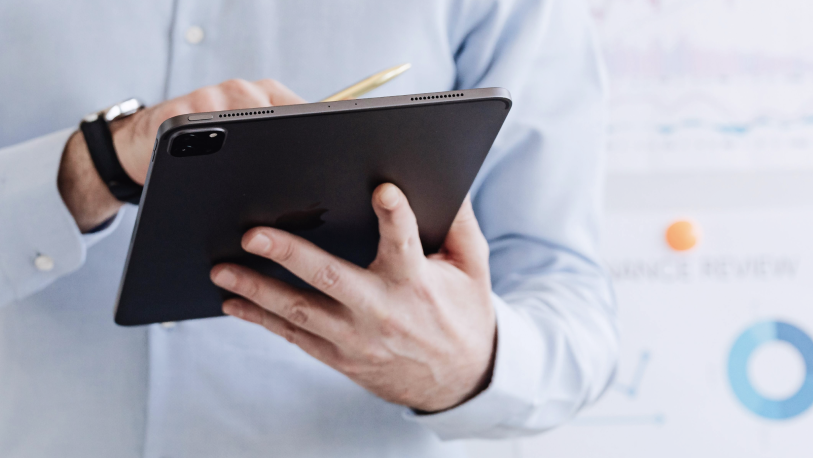 man using a tablet at work